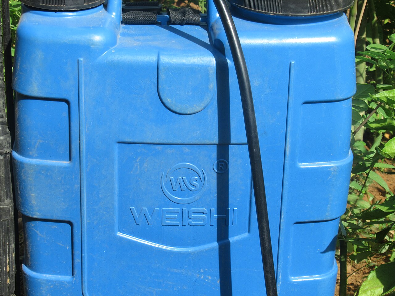 blue plastic sprayer tank